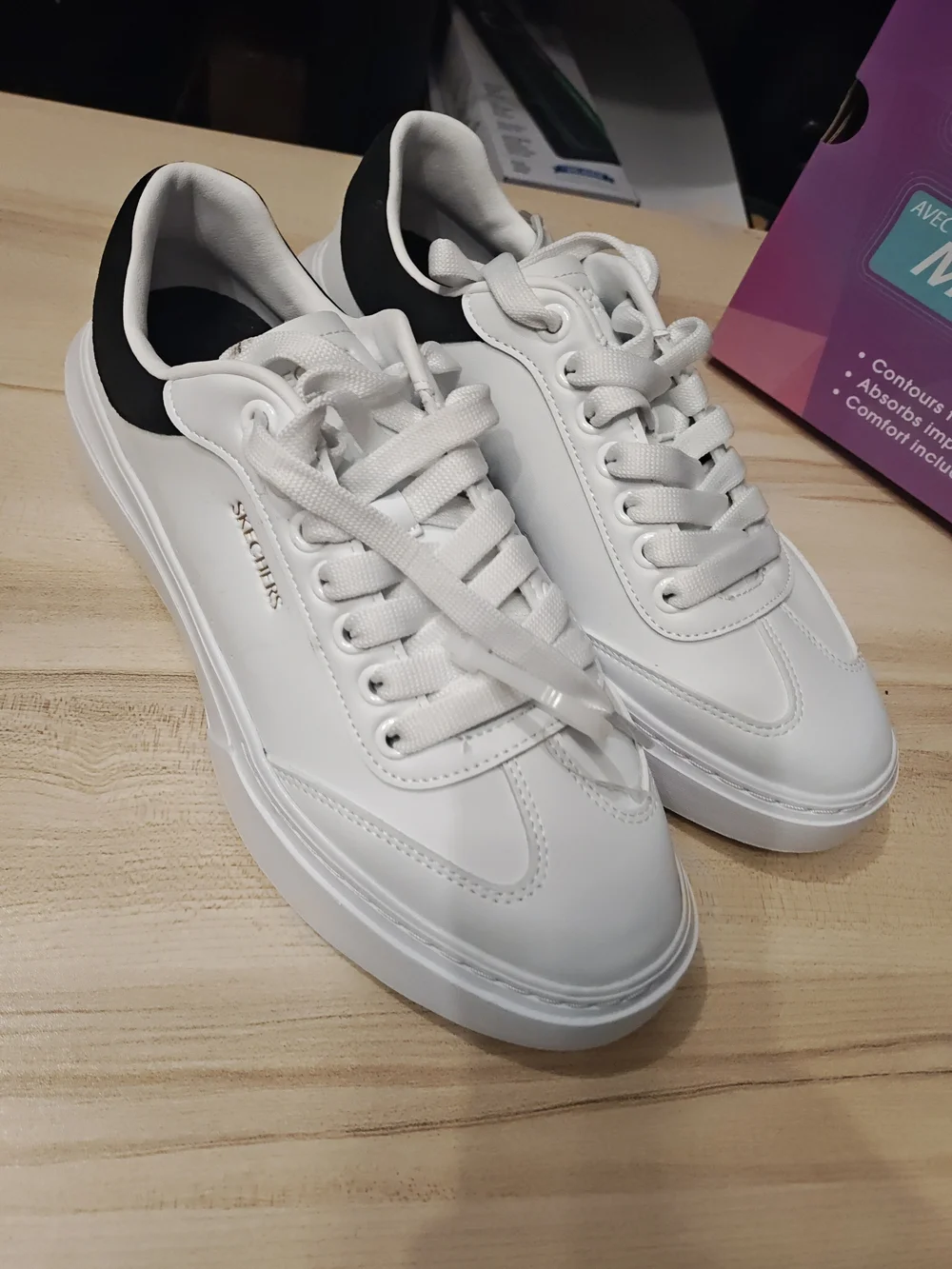 Skechers Men’s White Sneakers with Black Heel Accent 9